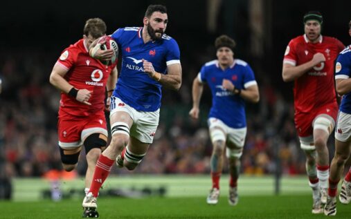 France rugby players grouping together for a team huddle during a Six Nations match