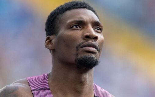Fred Kerley sprinting on the track during a 100m race