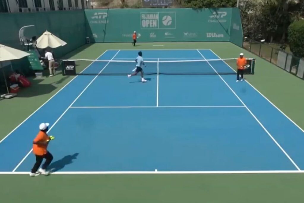 Tennis players rushing off the court at the Fujairah Challenger in the UAE