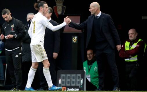 Gareth Bale and Zinedine Zidane sharing a moment on the touchline during their time at Real Madrid