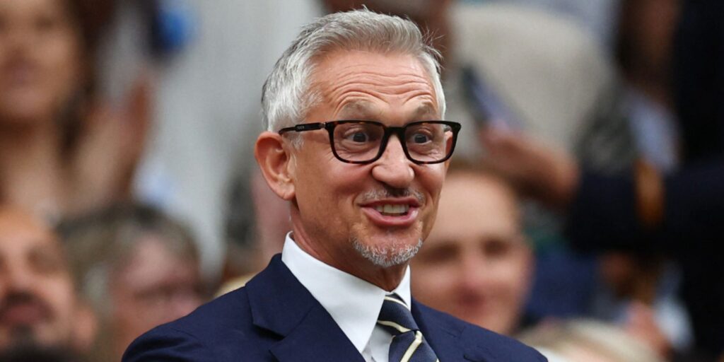 Gary Lineker gesturing while speaking into a microphone on a podcast