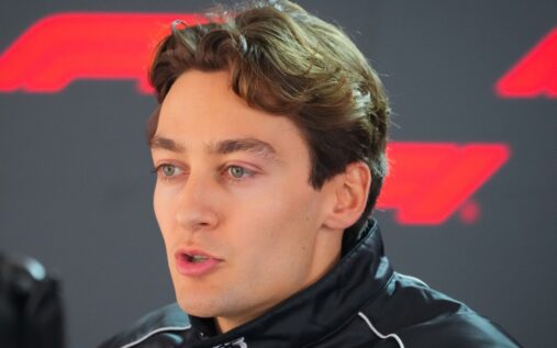 Mercedes driver George Russell speaking to the media in the Formula 1 paddock