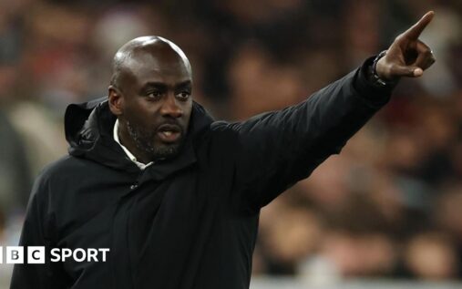Otto Addo standing on the touchline managing the Ghana national team
