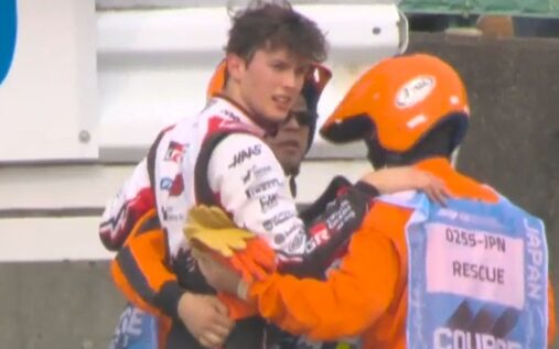 Oliver Bearman walking away from his wrecked Haas Formula 1 car after a heavy crash at the Japanese Grand Prix