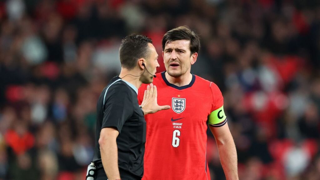 Harry Maguire expressing frustration on the pitch during England's match against Uruguay