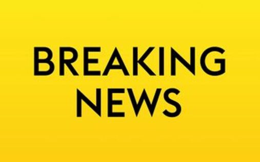 The iconic Olympic rings displayed prominently outside a major sporting venue