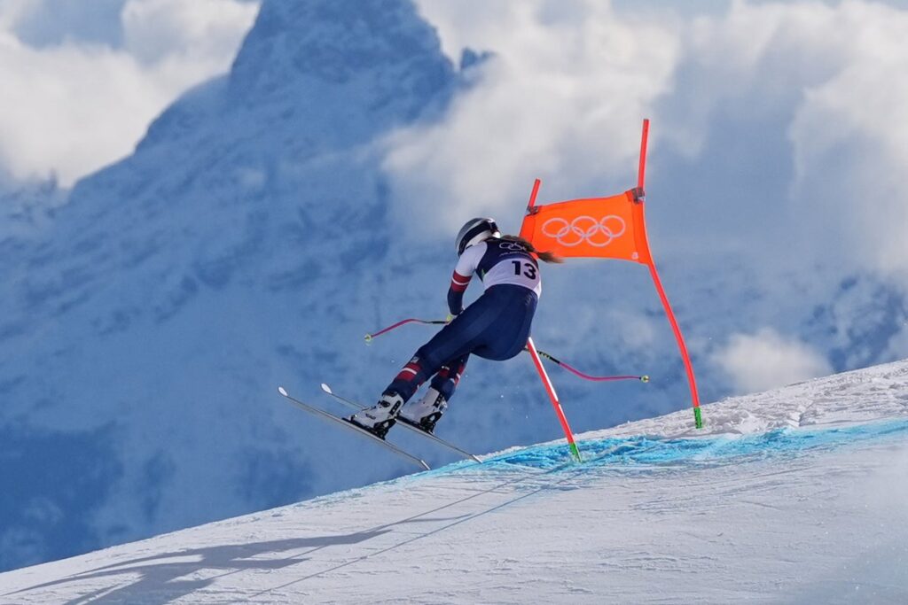 Laura Pirovano celebrating on the podium after winning the downhill World Cup race in Val di Fassa
