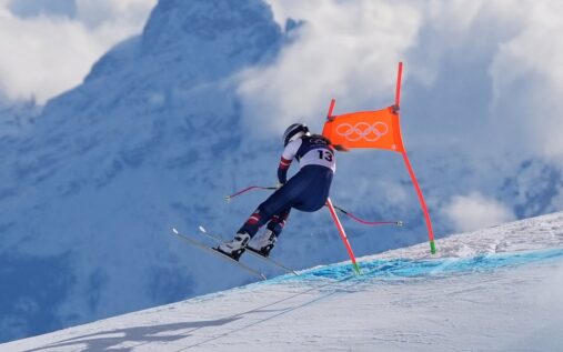 Laura Pirovano celebrating on the podium after winning the downhill World Cup race in Val di Fassa