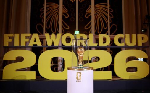 The Fifa World Cup trophy displayed alongside Iranian and American national flags