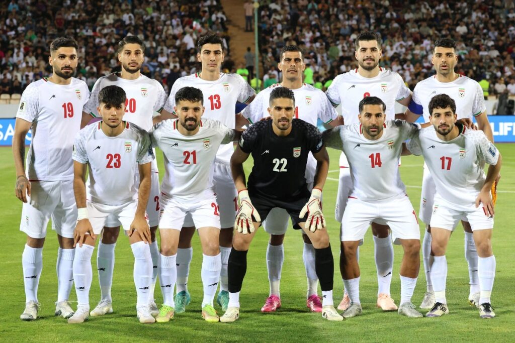 Iran national football team lining up on the pitch ahead of a World Cup qualifying match