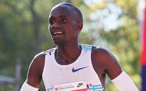 Jacob Kiplimo celebrating as he crosses the finish line at the Lisbon Half Marathon
