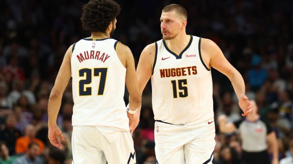 Jamal Murray driving to the basket for the Denver Nuggets against the Dallas Mavericks