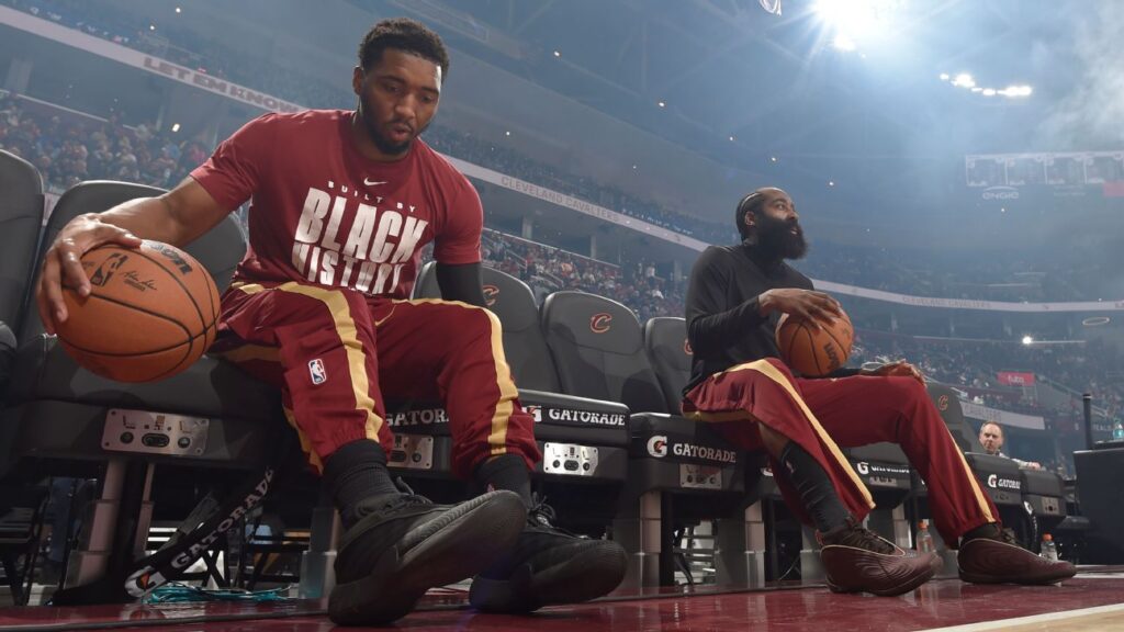 James Harden and Donovan Mitchell talking on the court during a Cleveland Cavaliers game