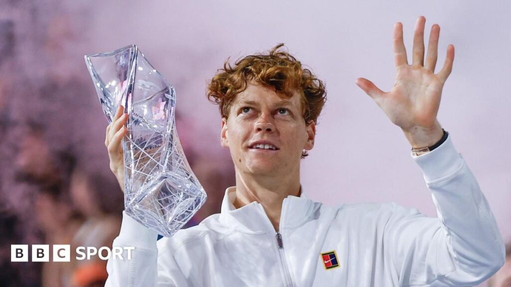 Jannik Sinner holding the Miami Open trophy and celebrating his victory