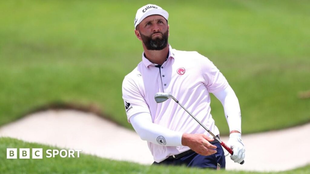 Jon Rahm looking contemplative on the golf course during a DP World Tour tournament