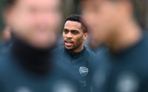 Arsenal defender Jurrien Timber gesturing on the pitch during a Premier League match