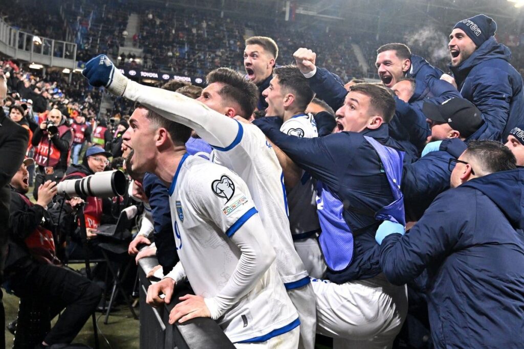 Kosovo national football team players celebrating on the pitch