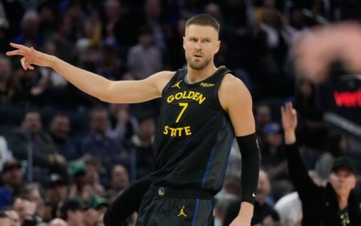 Kristaps Porzingis warming up in a Golden State Warriors jersey before a game