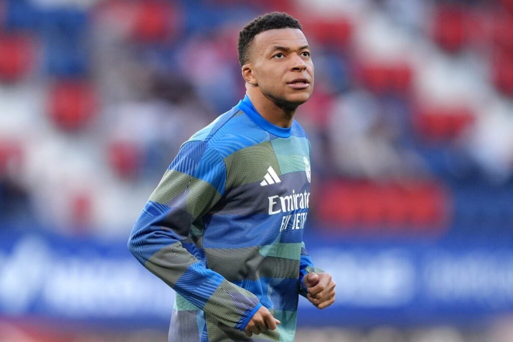 Kylian Mbappe looking focused while warming up for France ahead of an international match
