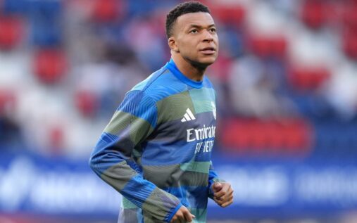 Kylian Mbappe looking focused while warming up for France ahead of an international match