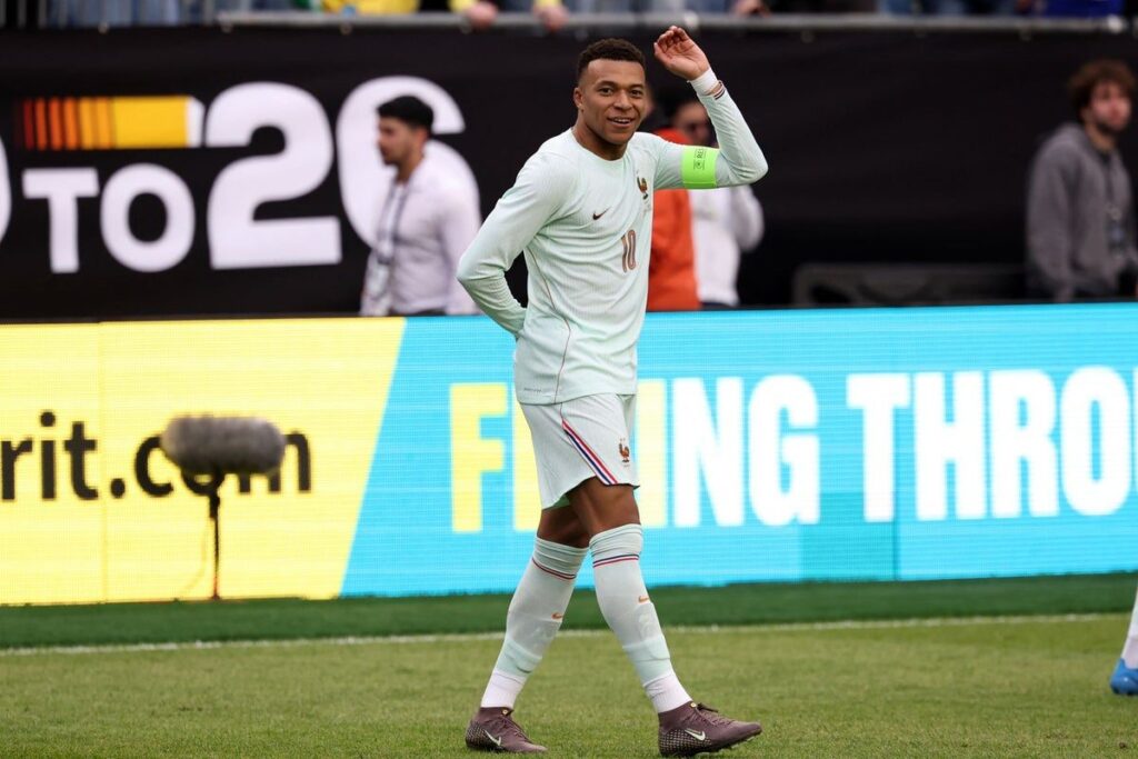 Kylian Mbappe controlling the ball for France during their international friendly match against Brazil