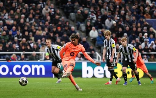 Lamine Yamal celebrates scoring a stoppage-time penalty for Barcelona against Newcastle