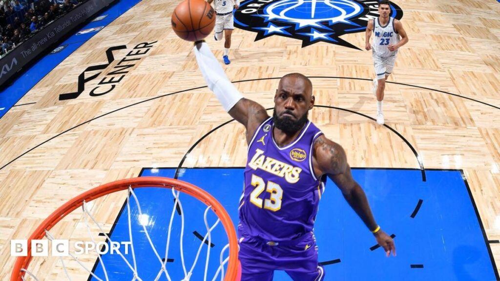 LeBron James playing for the Los Angeles Lakers during his record-breaking 1,612th NBA regular-season game