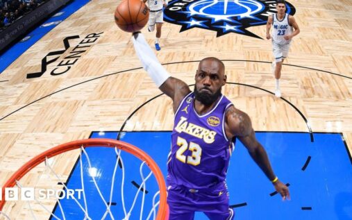 LeBron James playing for the Los Angeles Lakers during his record-breaking 1,612th NBA regular-season game