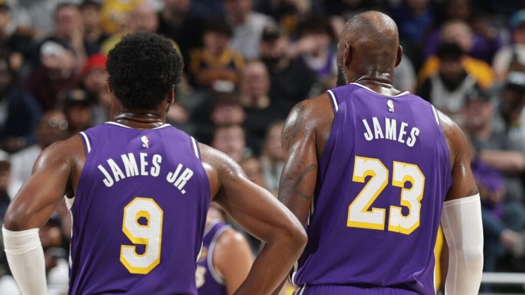 LeBron James passing the basketball to his son Bronny James during a Los Angeles Lakers game