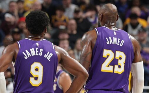 LeBron James passing the basketball to his son Bronny James during a Los Angeles Lakers game
