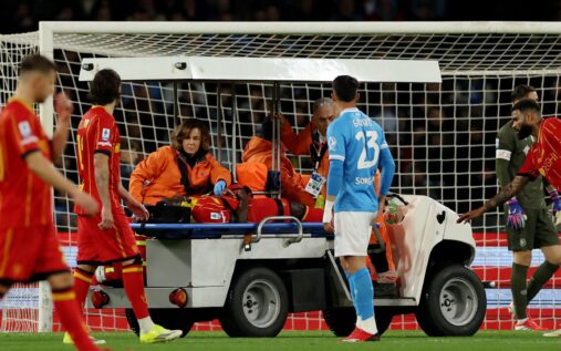 Lecce medical staff attending to Lameck Banda on the pitch