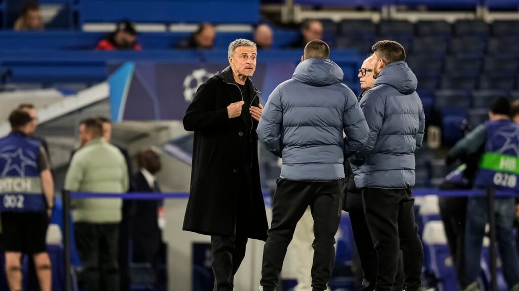Paris Saint-Germain players lining up on the pitch ahead of a Champions League football match