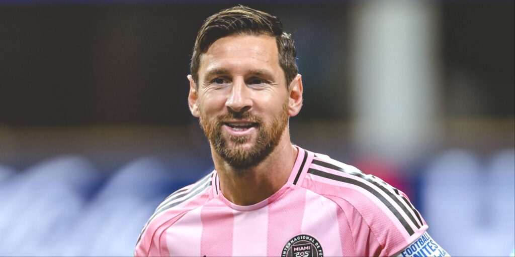 Lionel Messi looking focused while playing for Inter Miami in their pink home kit