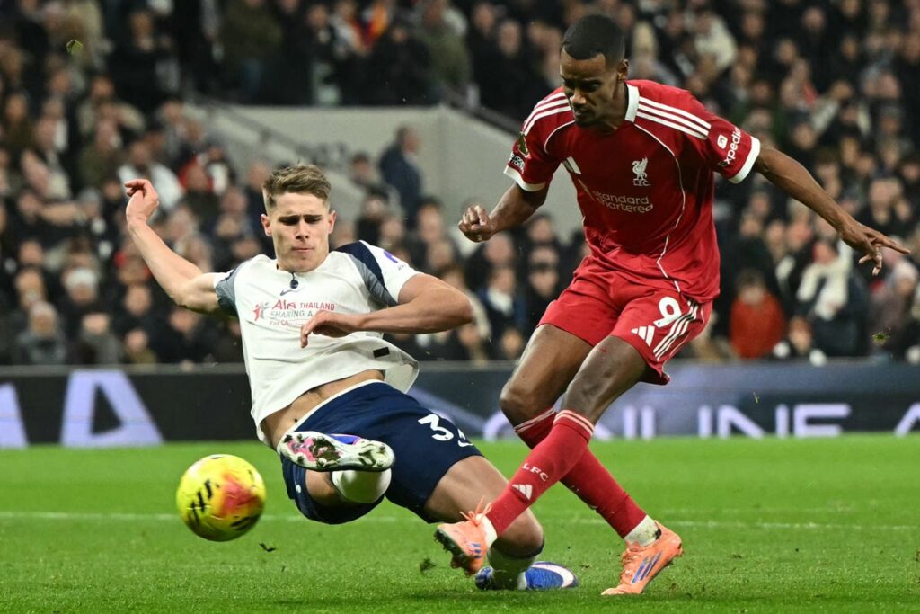Liverpool striker Alexander Isak walking on the pitch during a match