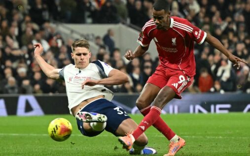 Liverpool striker Alexander Isak walking on the pitch during a match