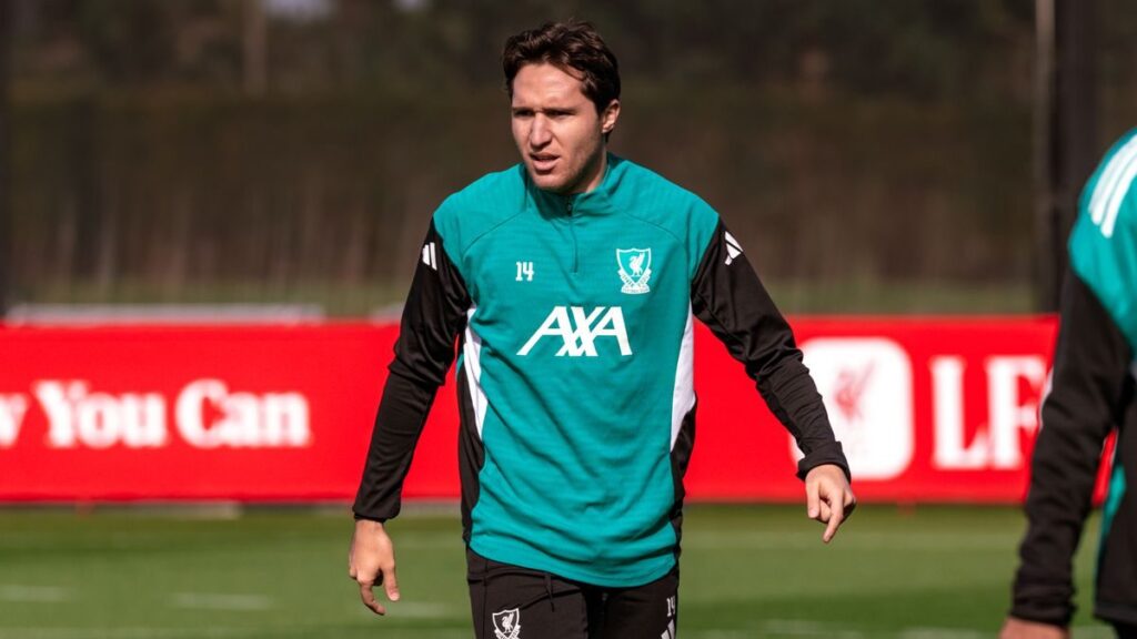 Federico Chiesa looking dejected on the pitch wearing a Liverpool shirt