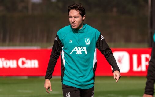 Federico Chiesa looking dejected on the pitch wearing a Liverpool shirt