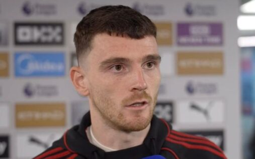 Andy Robertson celebrating a goal for Liverpool against Wolves in the FA Cup