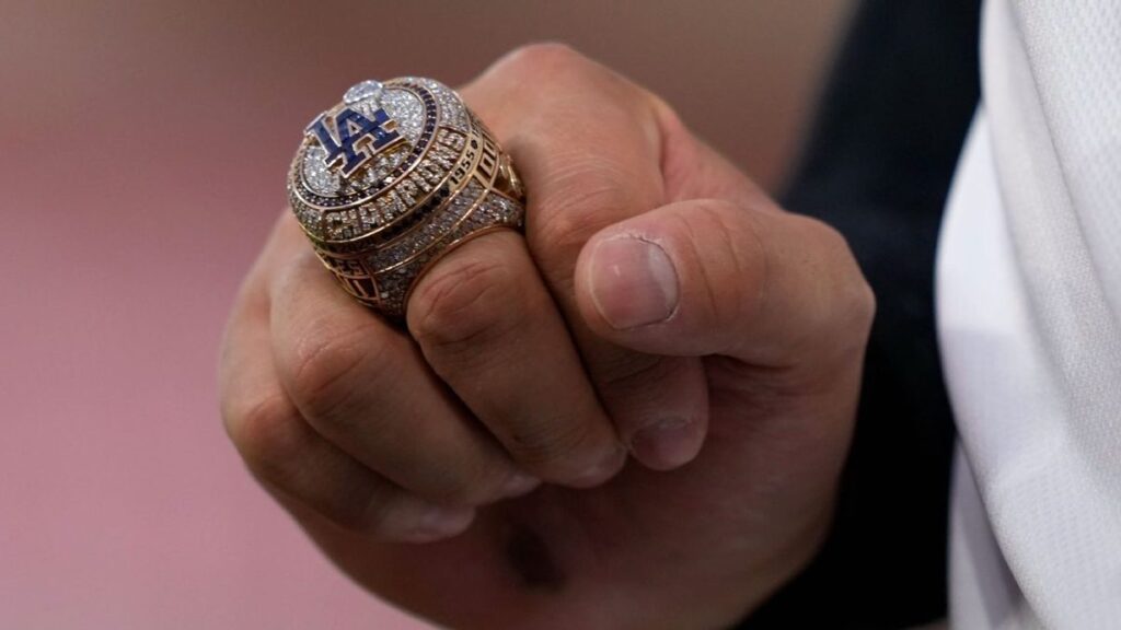 Shohei Ohtani and Los Angeles Dodgers players displaying their 2025 World Series rings during a pregame ceremony