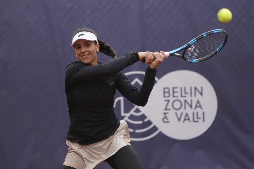 Lucrezia Stefanini playing a forehand shot during a professional tennis match on a hard court