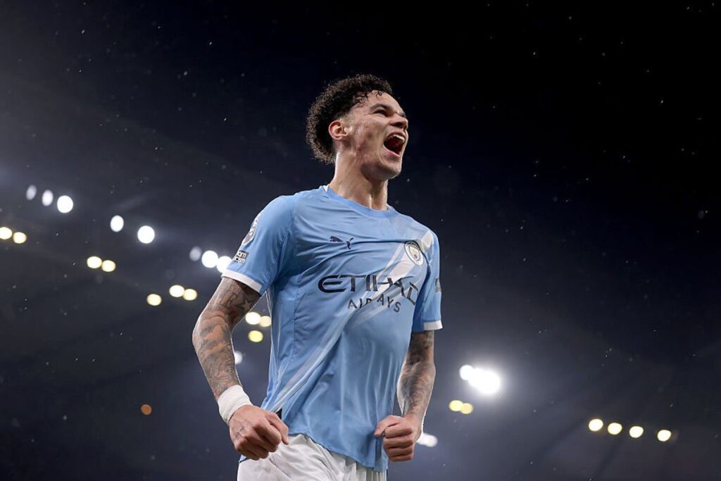 Nico O'Reilly playing for Manchester City on the football pitch