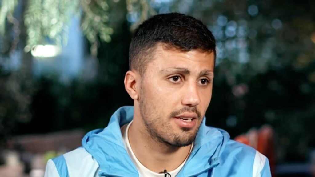 Manchester City midfielder Rodri looking contemplative on the football pitch