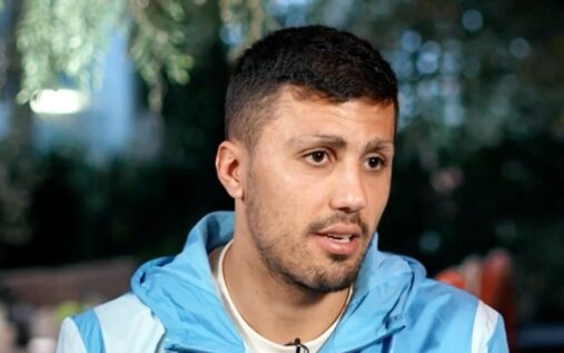 Manchester City midfielder Rodri looking contemplative on the football pitch