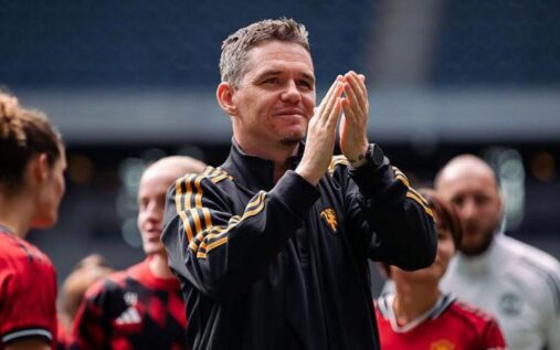 Manchester United manager Marc Skinner gesturing on the touchline during a Women's Super League match