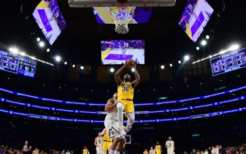 Marcus Smart of the Los Angeles Lakers celebrating a successful defensive play on the court