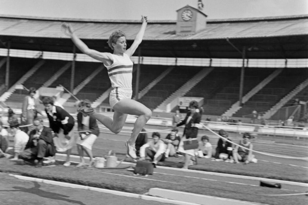 Mary Rand competing in the long jump at the 1964 Tokyo Olympic Games