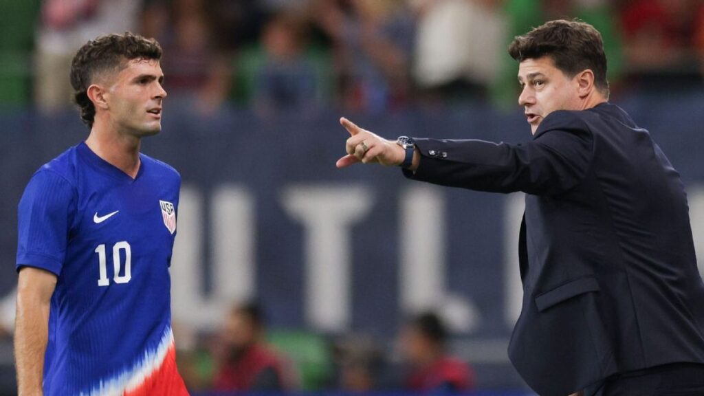 USMNT manager Mauricio Pochettino directing his players from the touchline during an international match.