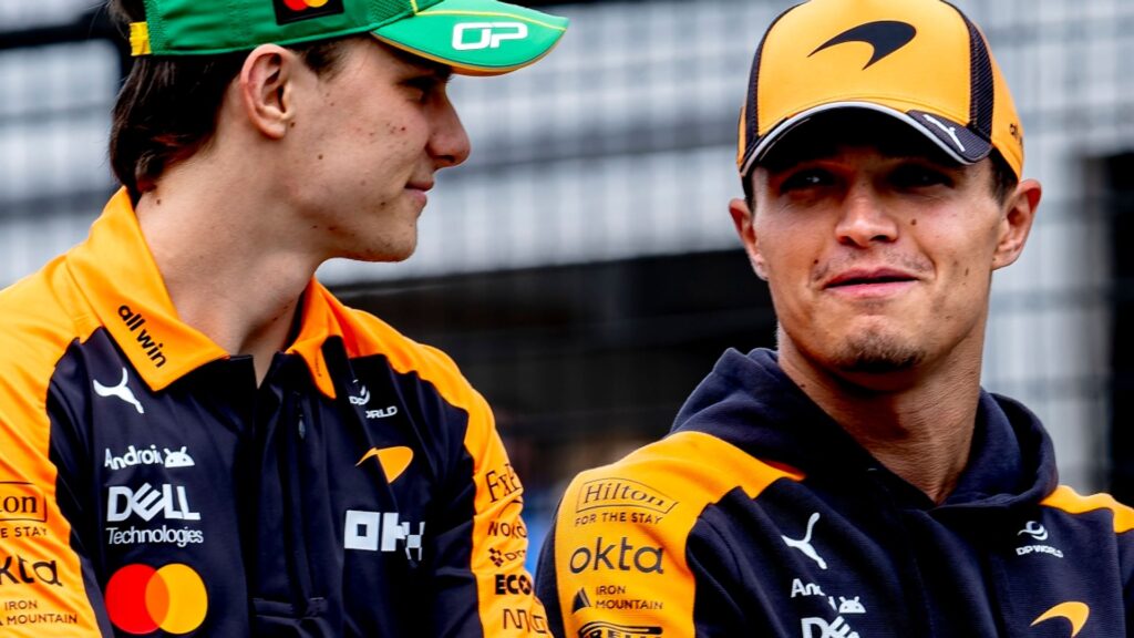 Lando Norris and Oscar Piastri walking together in McLaren team gear