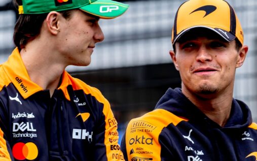 Lando Norris and Oscar Piastri walking together in McLaren team gear