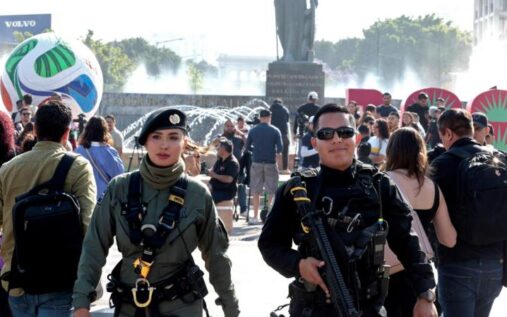 Mexican security forces standing in formation near a stadium venue